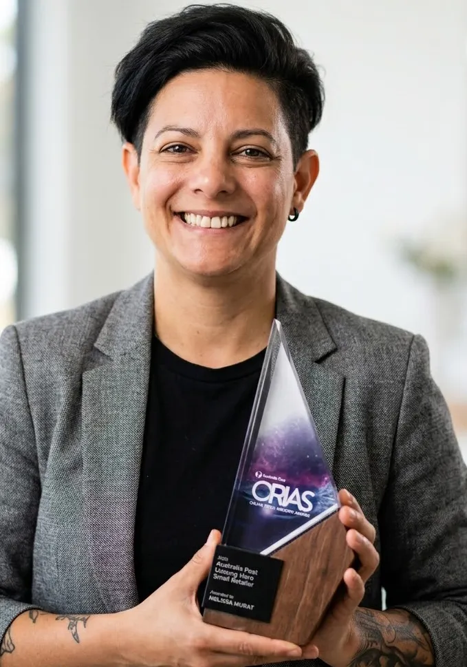 Melissa Murat holding her Australia Post Unsung Hero Award (Small Retailer) from the 2020 Online Retail Industry Awards.